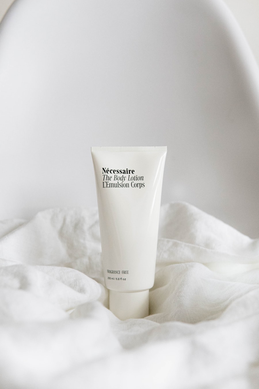 Minimal skincare product on soft white linen