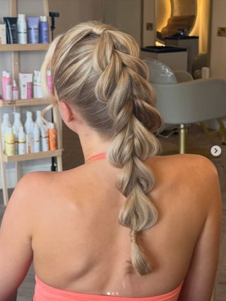 Long hair styled with a pull-through braid